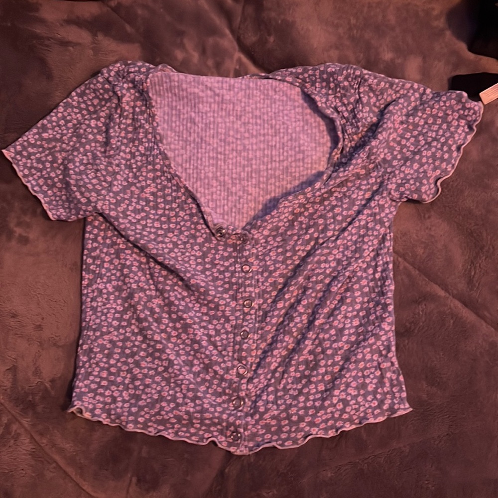 blue shirt with white flowers